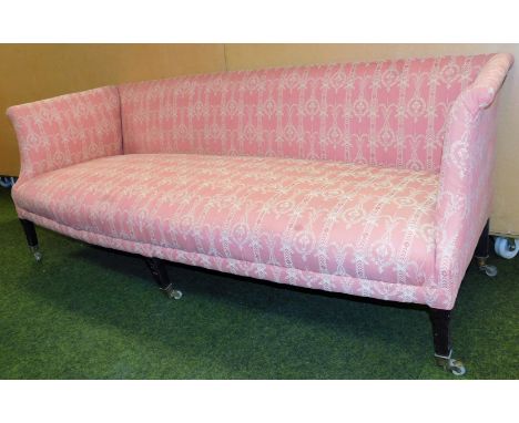 A Victorian upholstered three seater sofa, with a pink ribbon and urn design, on ebonised mahogany legs, 75cm high, 190cm wid