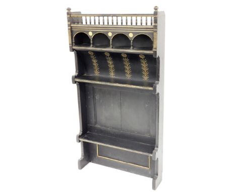 A Victorian ebonised aesthetic movement dresser top, the top with bobbin and arch panels, on floral engraving, with two shelf