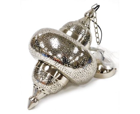 An Eastern style metal light fitting. 