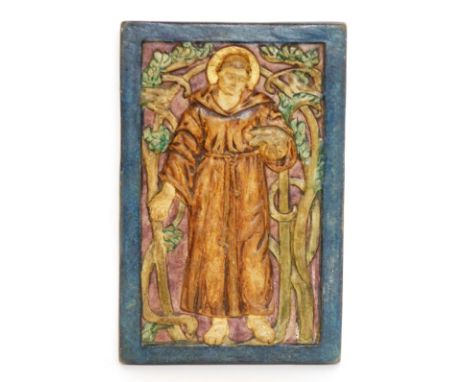 A Compton pottery plaque of a religious figure, in blue border Compton pottery stamp to reverse, 17cm x 11cm. 
