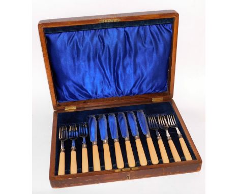 A set of fish knife and forks, with bone handles and silver tops bearing makers stamp JAS, in a walnut and blue velvet lined 