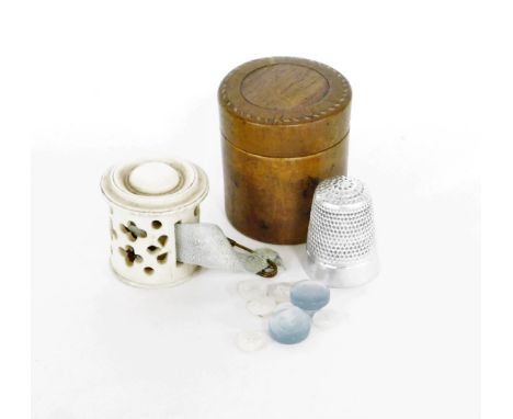 A miniature Tunbridgeware thimble case, with silver plated thimble and a miniature ivory tape measure case of pierced four le