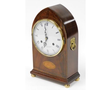 A Comitti of London Sheraton style lancet mantel clock, in a walnut case with marquetry banding, on a white ceramic dial with