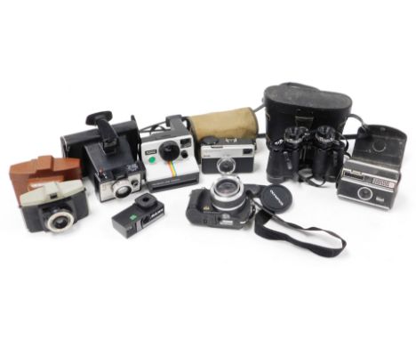 Various cameras and binoculars, to include an Olympus modern camera, a Kodak Instamatic 33, a Polaroid, various flashes, set 