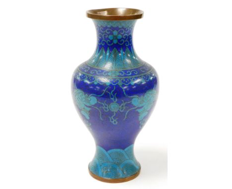 A Chinese cloisonné baluster vase, decorated with dragons chasing the flaming pearl, on a dark blue and turquoise ground with