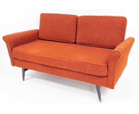 A retro 1960s Rest-u-Well two seater low sofa, with orange floral upholstery on mahogany capped legs, 83cm high, 142cm wide, 