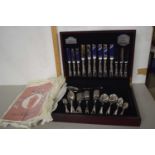 A canteen of plated cutlery with a design by Guy Degrenne in original box with metal plate for Guy