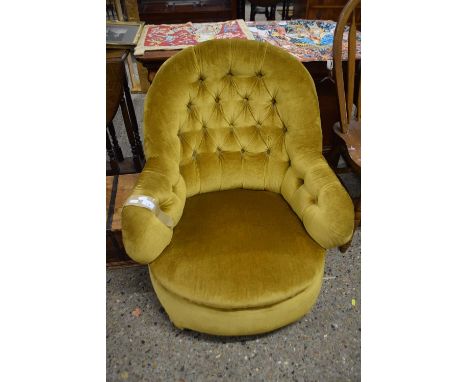 A late Victorian button upholstered armchair