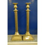 Two large candlesticks supported with Corinthian columns