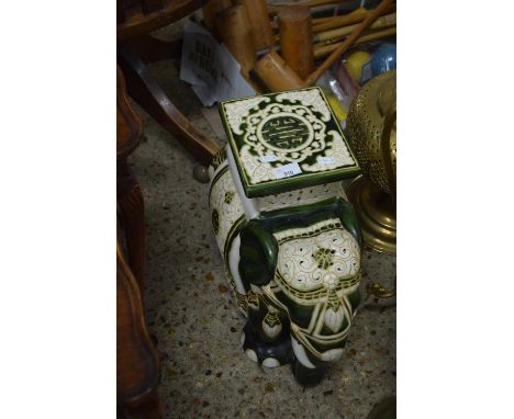 A ceramic elephant shaped jardiniere stand