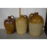 Group of three stone ware flagons, two with light brown bodies one with dark brown