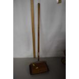 A Little Jewel carpet sweeper of toy size with wooden handle made by Bissell