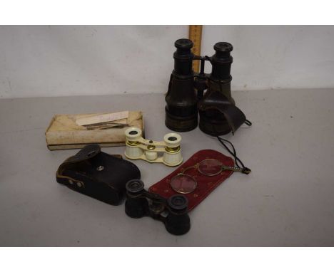 A plastic box containing a quantity of vintage binoculars including an opera example and a further cased example made in the 