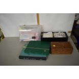 A plastic box containing a quantity of first day covers together with two stamp albums, stamps of