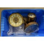 A plastic box containing a quantity of watches and watch spares
