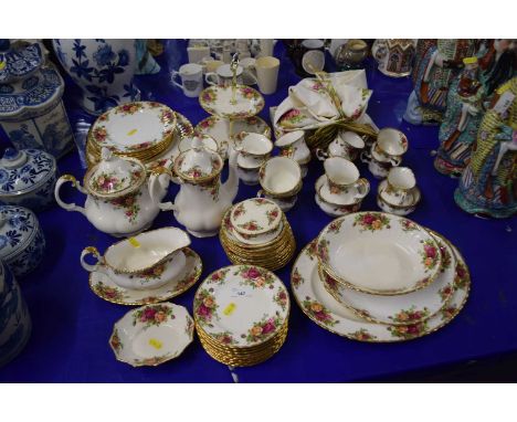 An extensive collection of Royal Albert Old Country Roses comprising six large plates, six smaller plates, cake plate, teapot