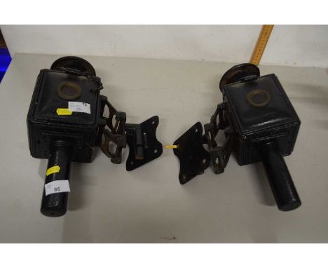 A pair of vintage coach lamps