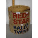 A large Red Star baler twine with paper label