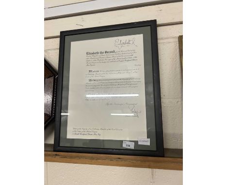 A framed Grant of Dignatory on the award of an OBE with facsimile signatures for Elizabeth R and Philip