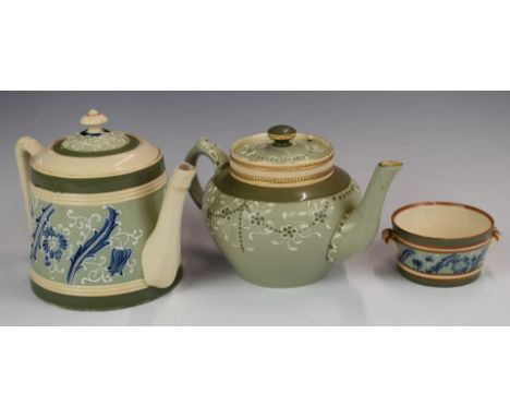 Two James Macintyre faience teapots and an unmarked twin handled sucrier, all decorated in the Florian Ware pattern, tallest 