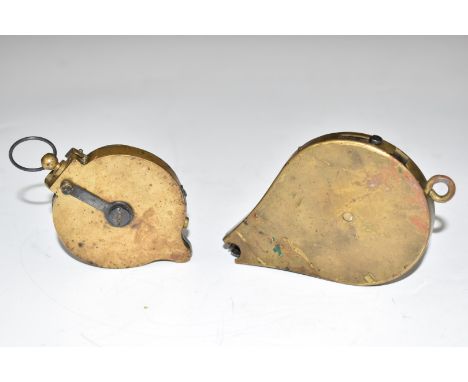 Two brass rotary percussion cap dispensers, both with belt loops, largest 11.5cm long.&nbsp;