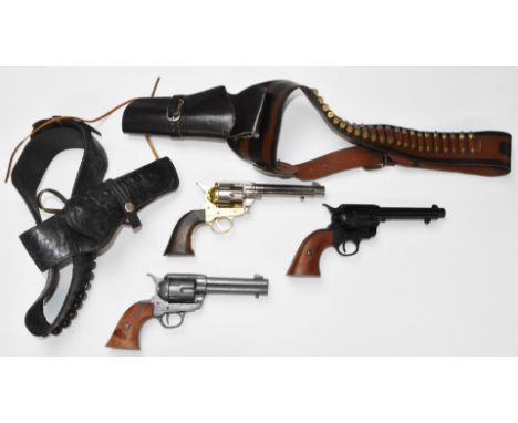 Three replica Colt single action Army .45 and similar revolvers together with various holsters, belts and accessories.&nbsp;