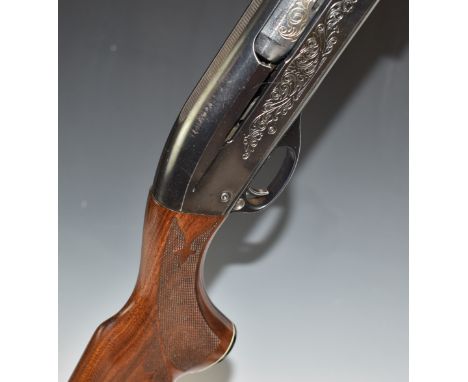 Remington model 1100 Sporter 12 bore 3-shot semi-automatic shotgun with ornately carved and chequered semi-pistol grip and fo