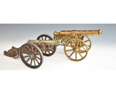 Two model cannon, one of bronze or brass construction, the other with wooden carriage bearing plaque to rear Louis XIV, lengt