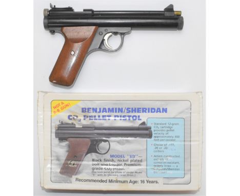 Benjamin Sheridan Model E9A .20 CO2 air pistol with shaped wooden grips and adjustable sights, serial number 397781823, in or