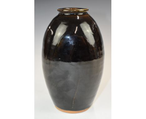 Bernard Leach St Ives studio pottery Tenmoku glazed vase of flattened form with incised willow tree decoration, incised Berna