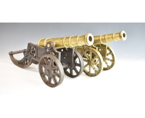 Two model cannon, one with cast iron carriage, length 46cm