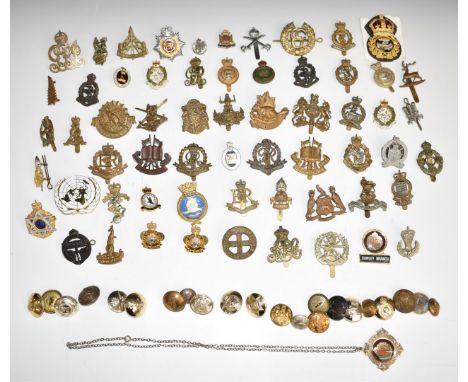 Approximately fifty metal military badges including Army Chaplain's Department, Military Provost Staff Corps, Military Police