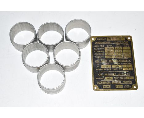 Merlin II engine identification plate together with six aluminium napkin rings, possibly constructed from a WW2 aeroplane