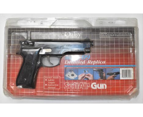 Daisy Model 09 6mm Beretta style airsoft pistol with monogrammed and chequered composite grips, serial number J61, in origina