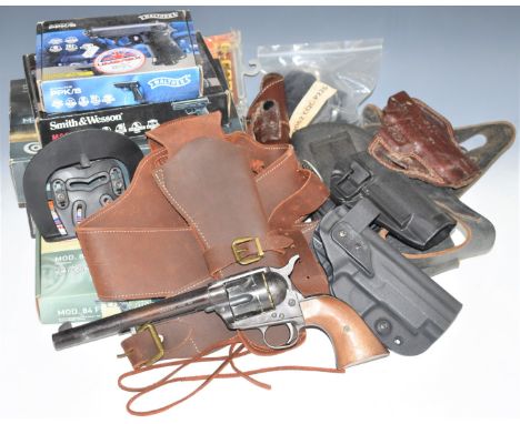 CMC Model 1968 replica .44 Cavalry revolver together with Umarex and similar holsters and various empty airsoft pistol boxes.