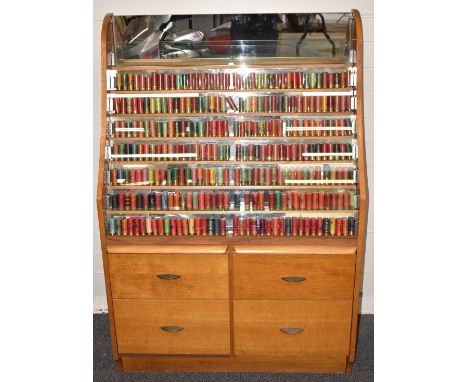 Three-hundred-and-twelve paper cased collector's shotgun cartridges in a purpose built mirror backed oak display cabinet, inc