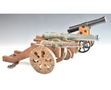 Three model cannon, one being a model of an 1815 Polish fortress cannon, length of longest 43cm