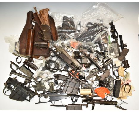 A large collection of rifle parts and accessories including Enfield bolt-action rifle actions, stocks, DWM action, Enfield No