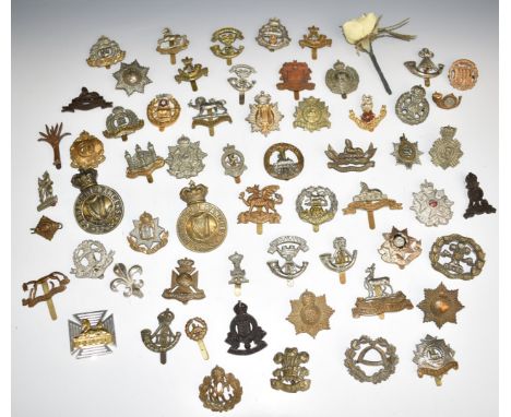 Approximately fifty British Infantry metal cap badges including East Surrey Regiment, Bedfordshire Regiment, Duke of Edinburg