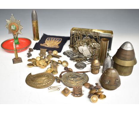 Small collection of military ephemera including buttons and badges for the Ordnance Corps and Royal Navy, fuse cones, inert a