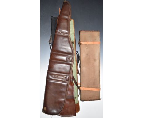 Vintage leather and canvas bound shotgun carry case (76 x 22 x 9cm) together with five shotgun slips.&nbsp;