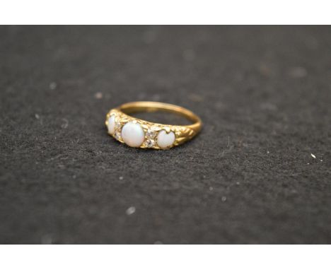 An 18ct Three Stone Opal and Diamond Ring 