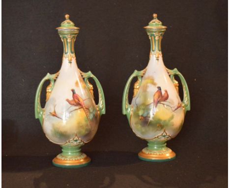 A Very Fine Pair of Royal Worcester Hadley Ware Hand Painted Two Handled Lidded Vases, signed A Shuck (11.5" high)