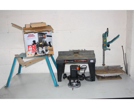 A BLACK AND DECKER BD66 ROUTER, a Black and Decker router table, another metal tool stand and a drill stand (Router looks unu