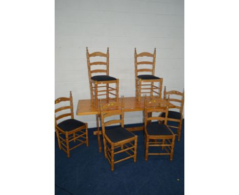 A MODERN PINE KITCHEN TABLE, length 168cm x depth 73cm x height 75cm and six ladder back chairs