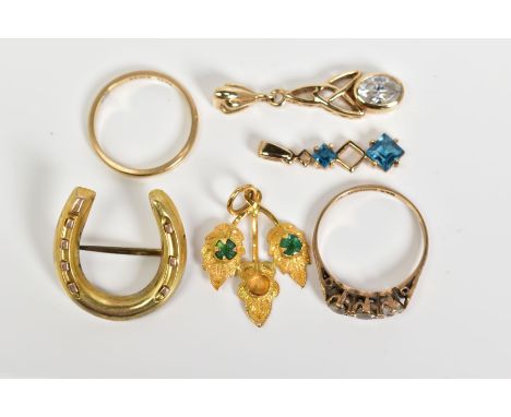 A SELECTION OF ITEMS, to include a 9ct gold pendant set with an oval cut cubic zirconia, Chester hallmark, a 9ct gold wedding