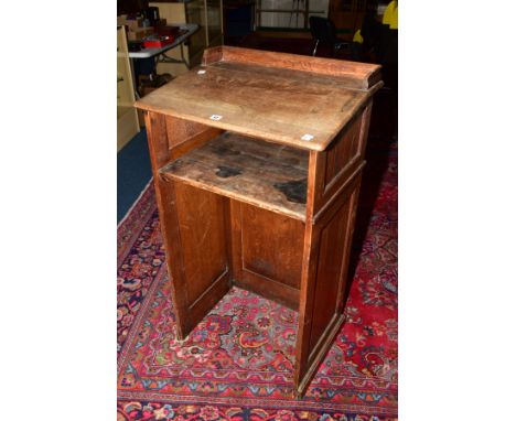 A LATE 19TH CENTURY OAK LECTURN, raised back, sloped top, tongue and groove panelled sides, single shelf to the interior, hei