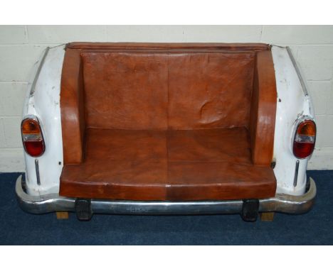 A TWO SEATER SOFA FORMED FROM POSSIBLY A 1960'S MORRIS OXFORD REAR END, covered with brown leatherette upholstery, width 160c