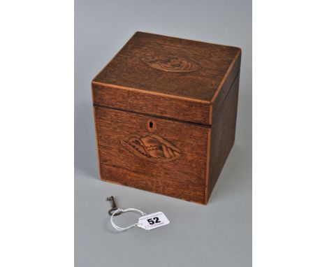 A GEORGE III MAHOGANY AND SATINWOOD INLAID TEA CADDY OF CUBE FORM, circa 1785, the hinged lid and front with shell paterae of