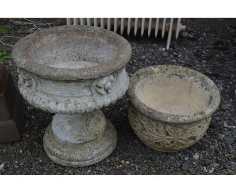 A PAIR OF COMPOSITE CIRCULAR GARDEN URNS on a seperate base, diameter 39cm x height 43cm and a circular composite planter (2)